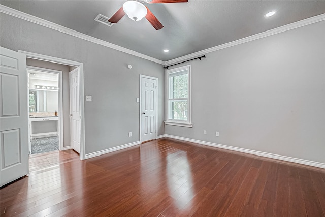 empty room with hardwood / wood-style flooring, ceiling fan, and ornamental molding