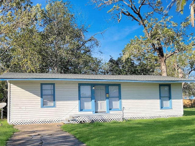 rear view of house with a lawn