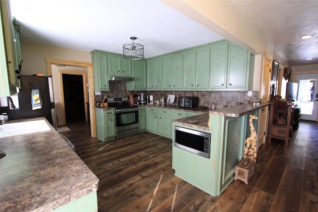 kitchen featuring green cabinets, stainless steel appliances, and dark hardwood / wood-style floors