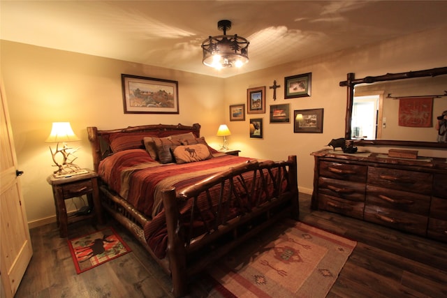 bedroom featuring dark hardwood / wood-style flooring