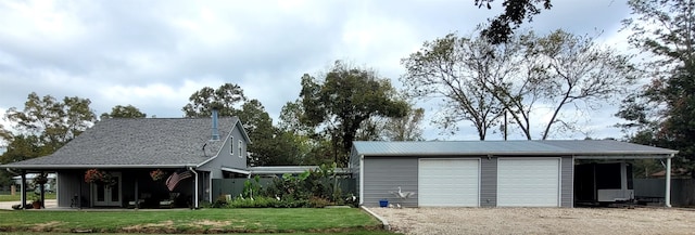 garage featuring a lawn