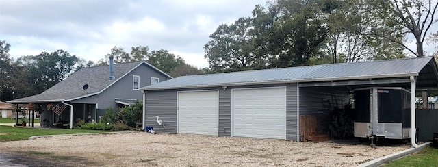 garage featuring a carport