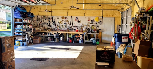 garage featuring a workshop area and ceiling fan