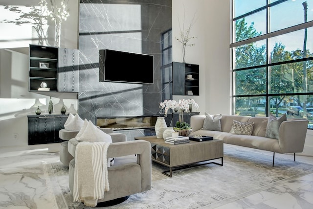 living room featuring a high ceiling