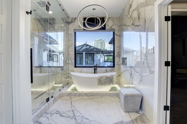 bathroom featuring separate shower and tub and tile walls