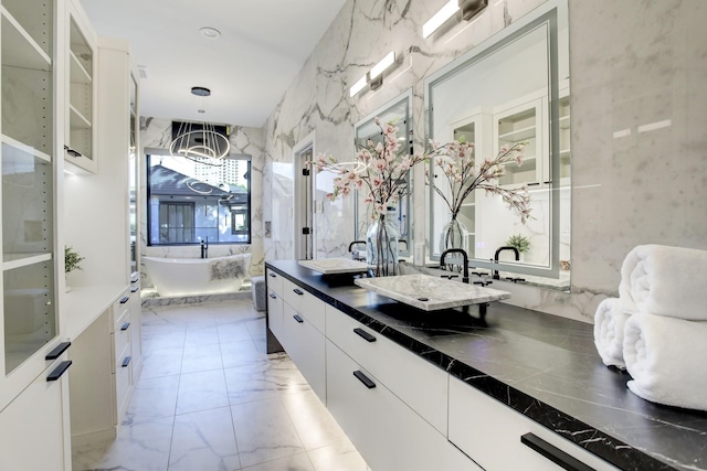 bathroom with a bathtub and vanity