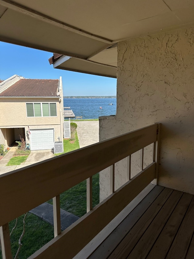 balcony featuring a water view