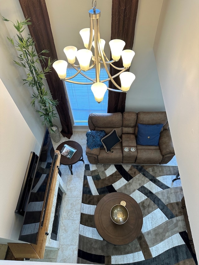 living room featuring tile patterned floors and an inviting chandelier