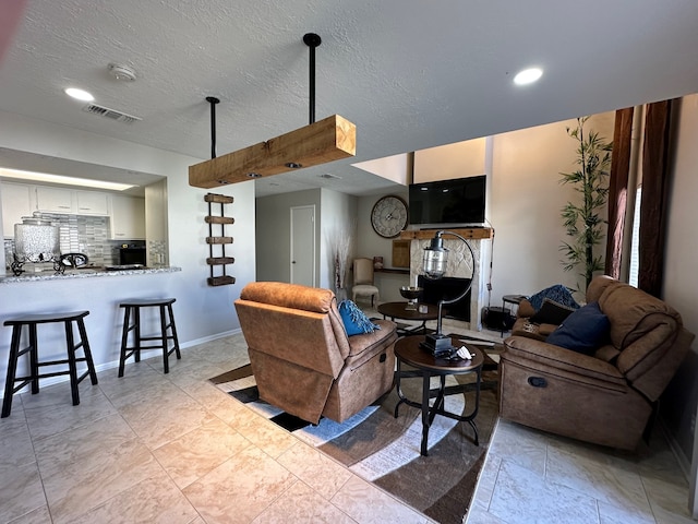 living room featuring a textured ceiling