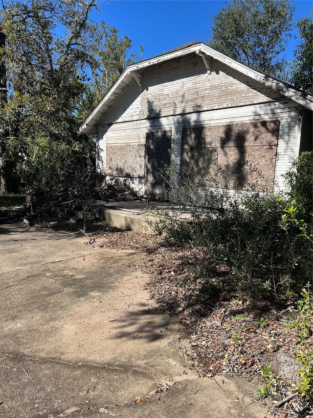 view of home's exterior featuring a garage and an outdoor structure