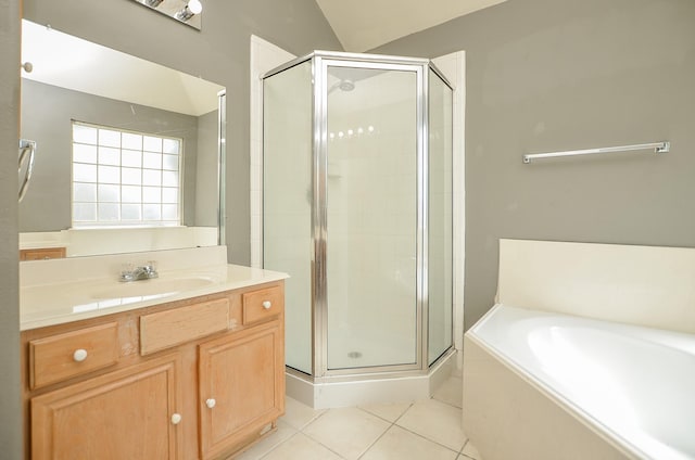 bathroom featuring vanity, tile patterned flooring, plus walk in shower, and lofted ceiling