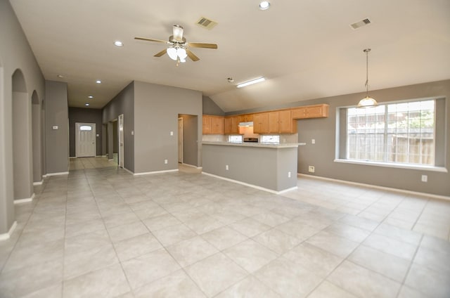 unfurnished living room featuring ceiling fan and vaulted ceiling