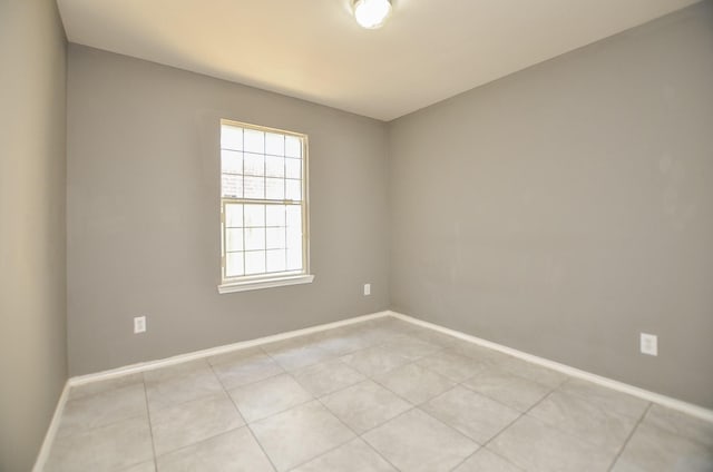 unfurnished room featuring light tile patterned floors