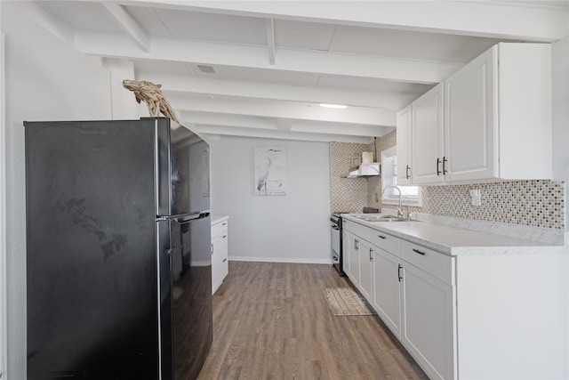 kitchen featuring hardwood / wood-style floors, black refrigerator, white cabinetry, and stainless steel range with electric cooktop