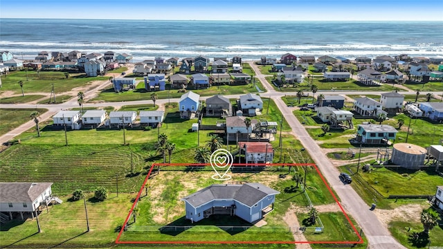 219 Fort Velasco Dr, Surfside Beach, TX 77541 - aerial view of residential area with property boundaries highlighted and a nearby body of water
