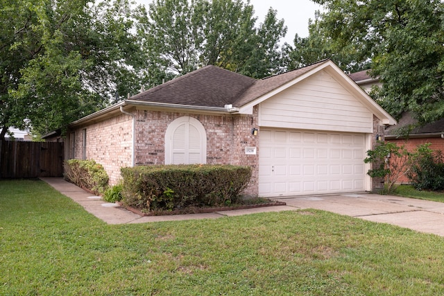 ranch-style house with a front yard and a garage