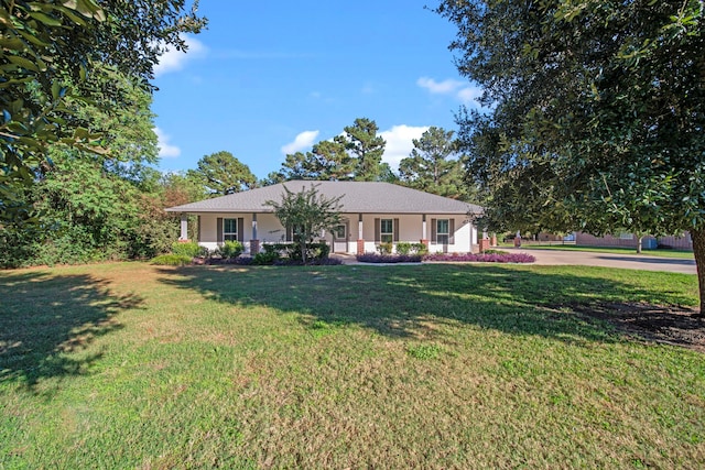 ranch-style home featuring a front yard