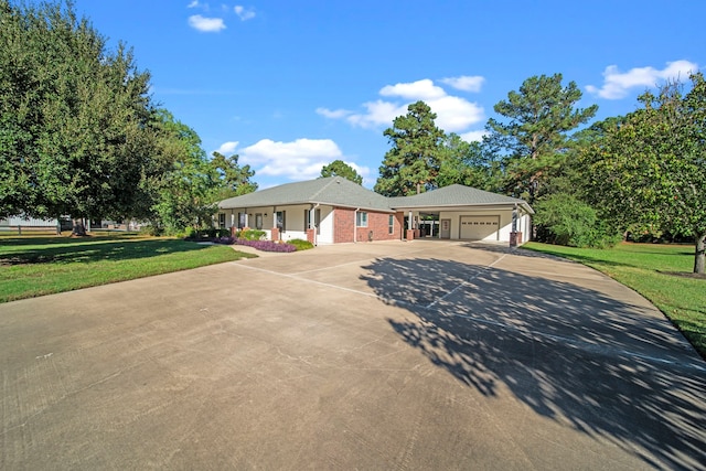 single story home with a garage and a front yard