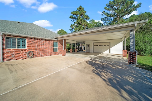 exterior space featuring a garage and a carport