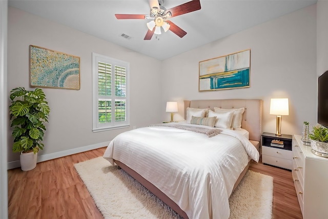 bedroom featuring ceiling fan and light wood-type flooring