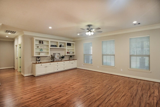 unfurnished living room with hardwood / wood-style flooring, ceiling fan, and ornamental molding