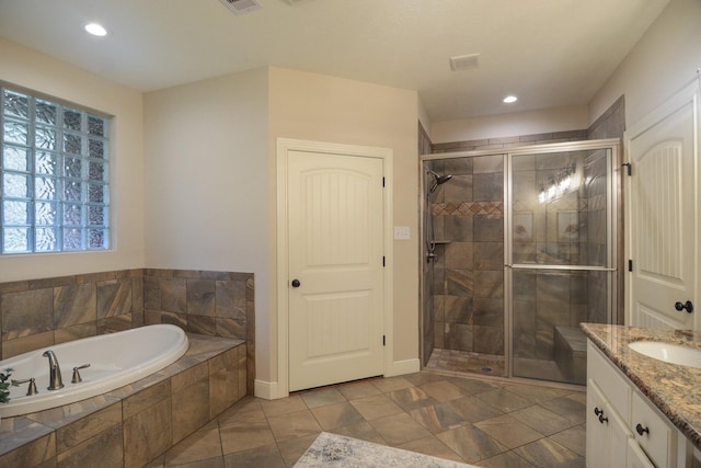 bathroom with separate shower and tub, tile patterned flooring, and vanity