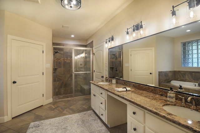 bathroom featuring tile patterned flooring, vanity, and independent shower and bath