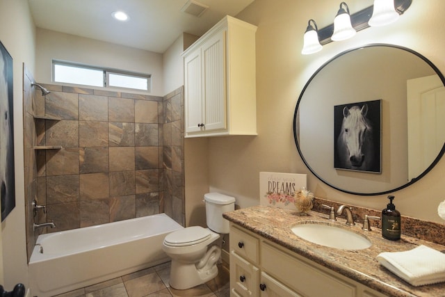 full bathroom with tile patterned floors, toilet, vanity, and tiled shower / bath