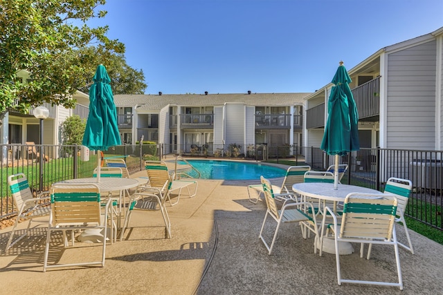 view of pool featuring a patio