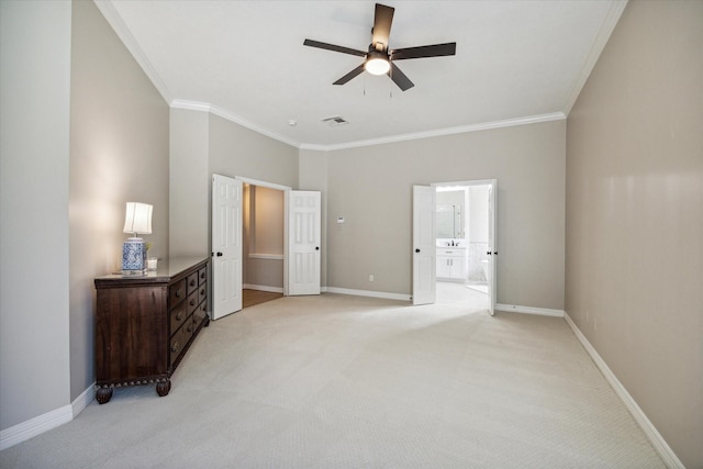 bedroom featuring crown molding, light colored carpet, ceiling fan, and ensuite bathroom