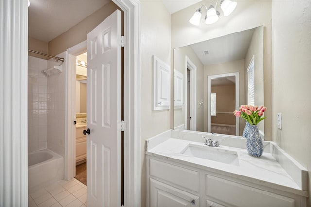 bathroom with tile patterned floors, shower / washtub combination, and vanity