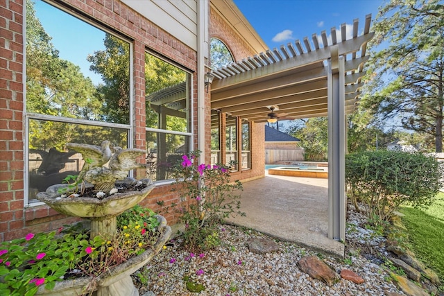 view of patio with ceiling fan