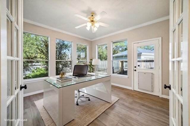 office space with french doors, ceiling fan, ornamental molding, and light hardwood / wood-style floors