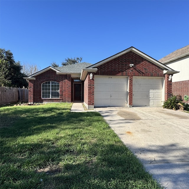 ranch-style home with a front yard and a garage