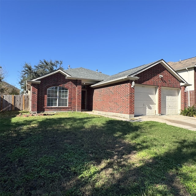 single story home with a front yard and a garage