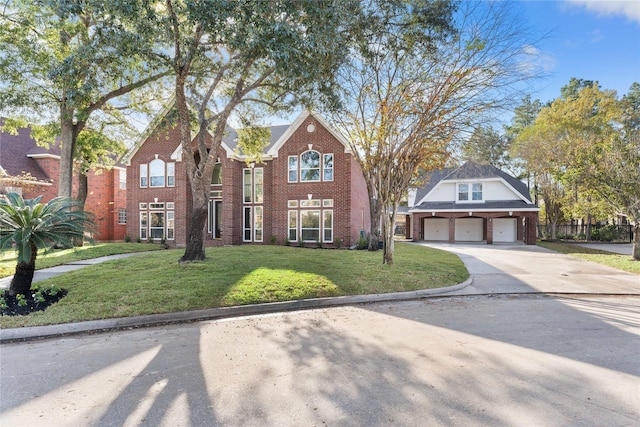 view of property with a garage and a front yard