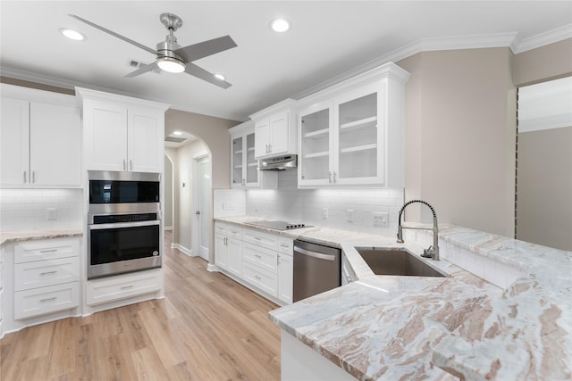 kitchen with white cabinets, sink, and stainless steel appliances