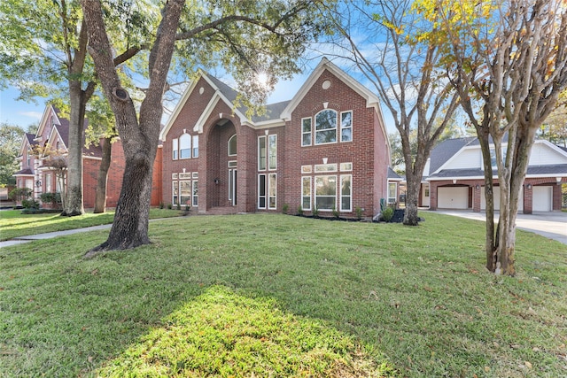 view of front property with a front yard and a garage