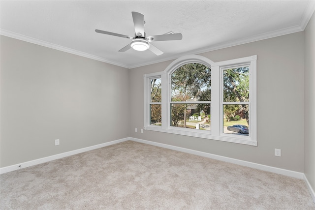 unfurnished room with light carpet, ceiling fan, and ornamental molding