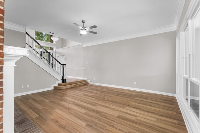 6627 Butler Oaks Ct, Spring, TX 77389 - unfurnished living room with ceiling fan, baseboards, stairs, ornamental molding, and wood finished floors