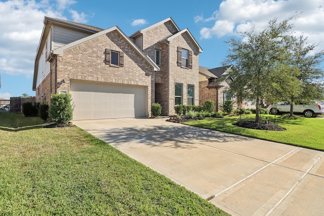 view of front of property featuring a garage and a front yard