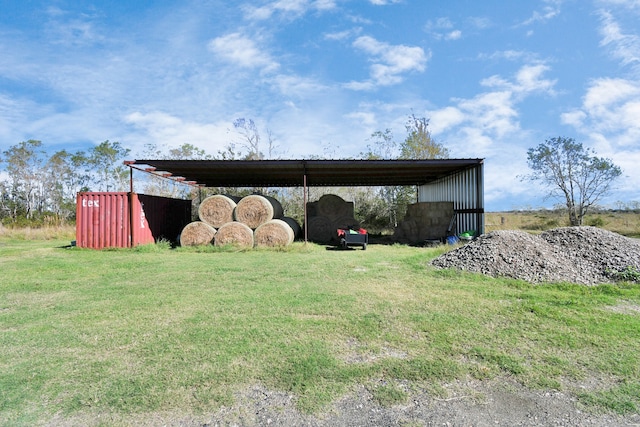 view of outdoor structure with a yard