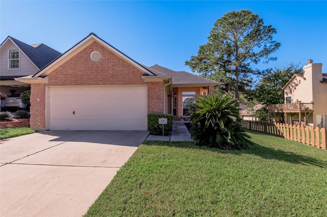 view of front of home with a front yard and a garage