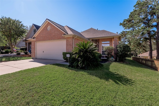 view of front of house with a garage and a front yard