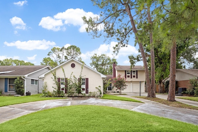 view of front of home with a garage and a front lawn