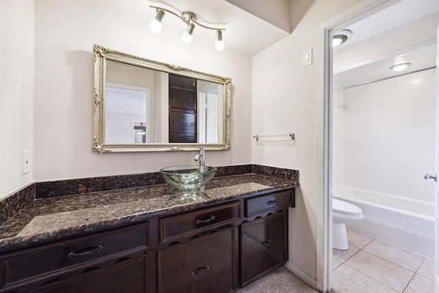 full bathroom with tile patterned flooring, vanity, toilet, and tiled shower / bath combo