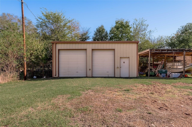 garage with a lawn