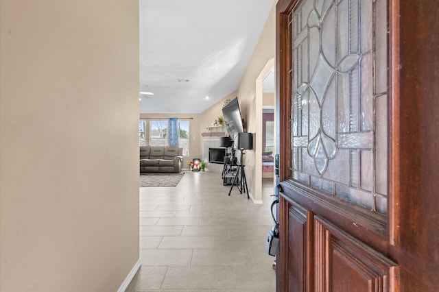 foyer entrance with light tile patterned flooring