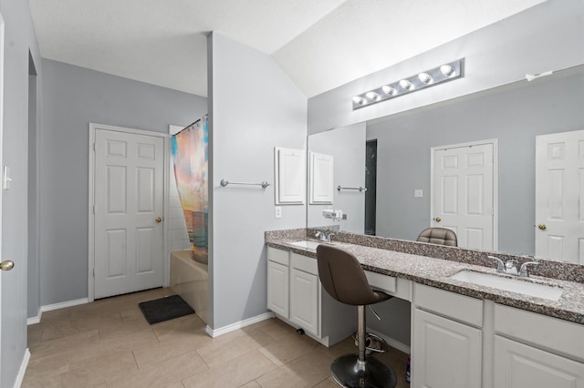 bathroom with tile patterned flooring, vanity, shower / tub combo with curtain, and lofted ceiling