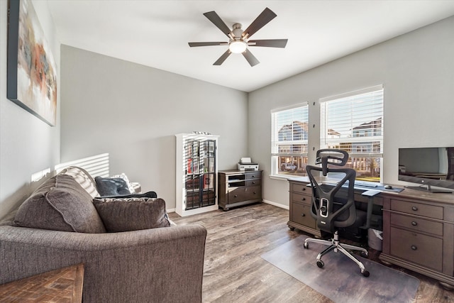 office area with hardwood / wood-style flooring and ceiling fan